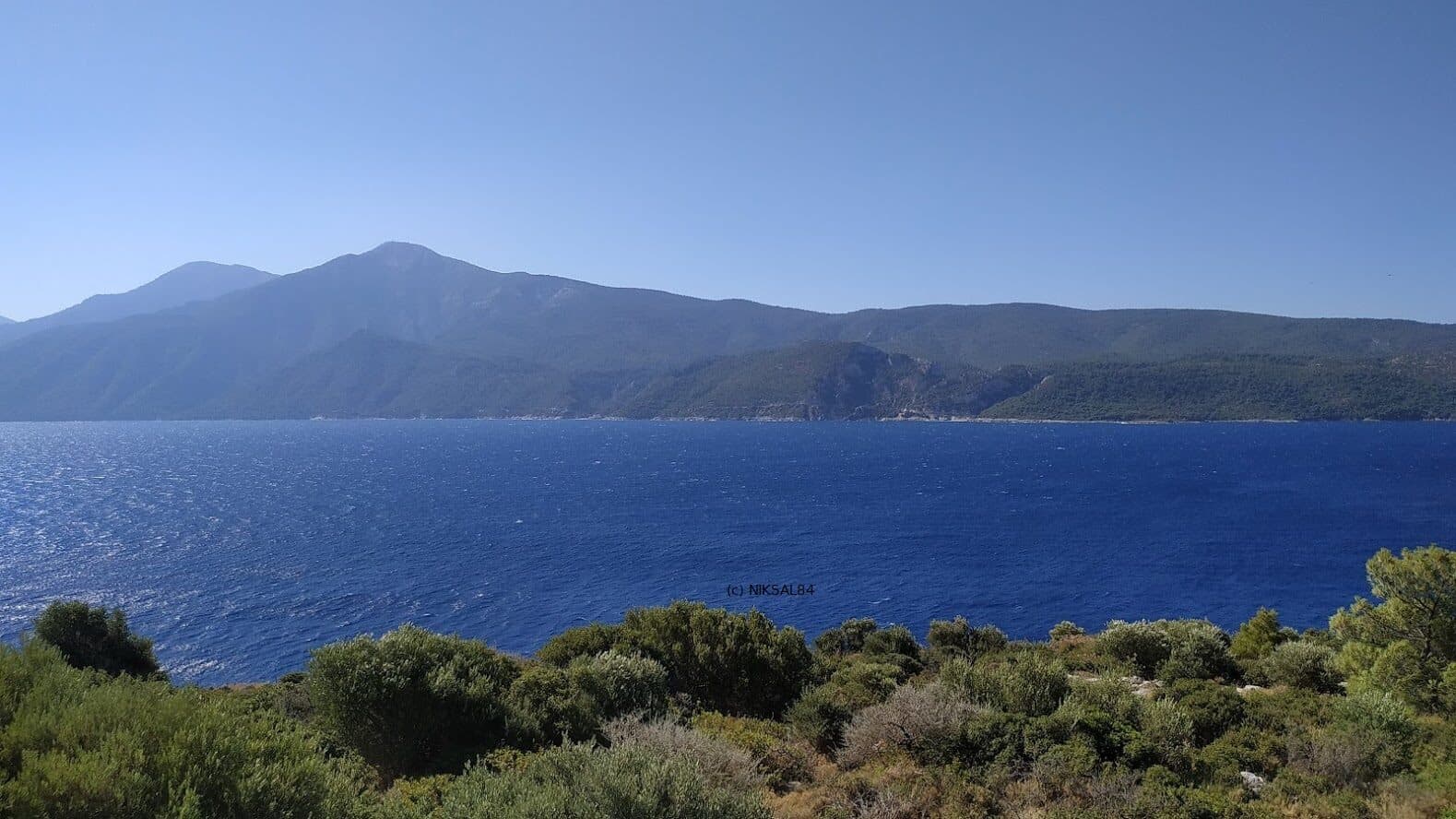 Turquoise water and rocky coves around Kasonisi islet off the south coast of Samos